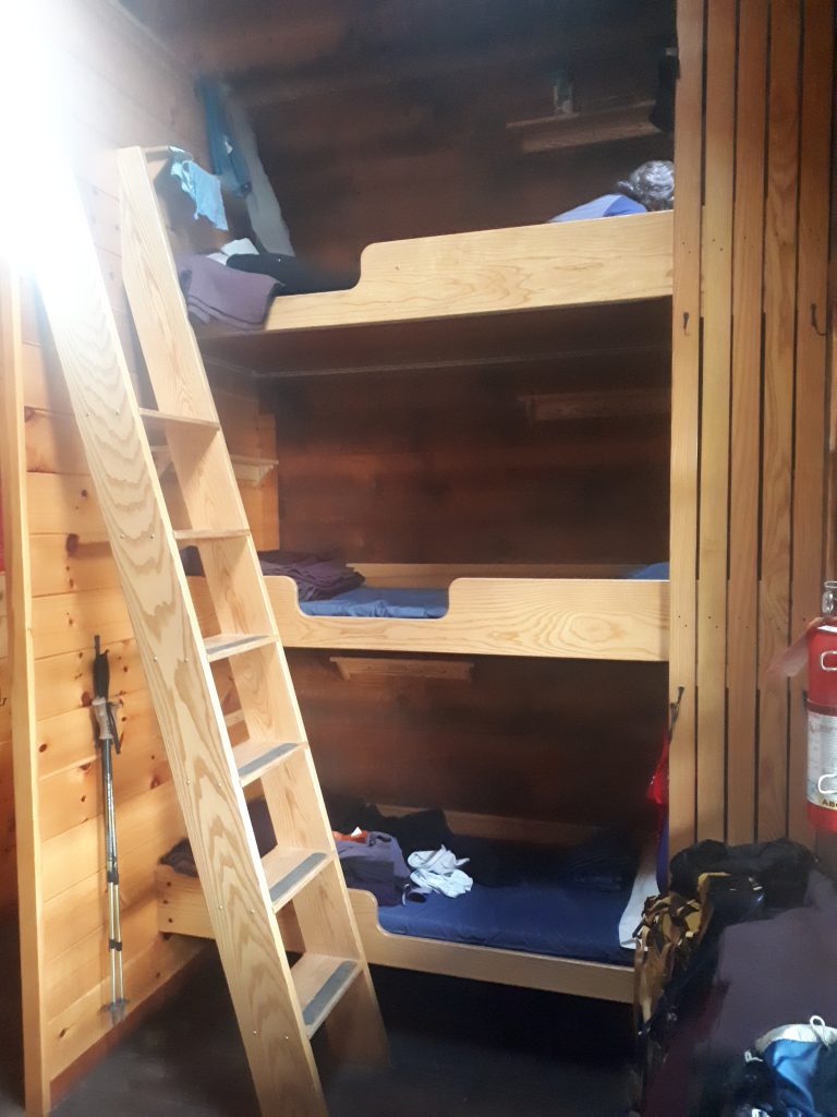 A set of triple bunk beds in an AMC hut.
