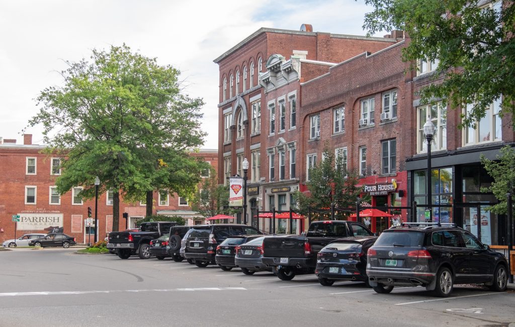 A downtown area filed with stately red brick buildings.