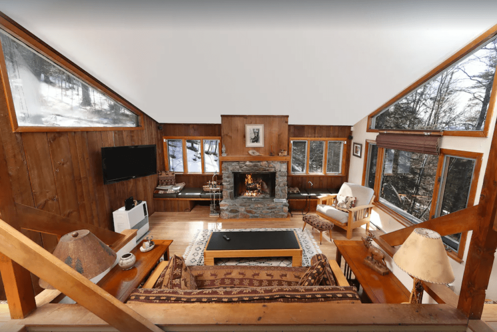 The inside of a log home with a fire place