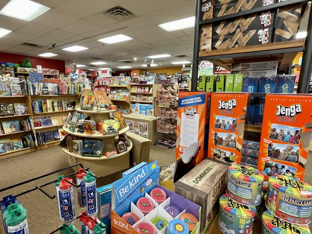 Displays of toys and books in a toy shop.