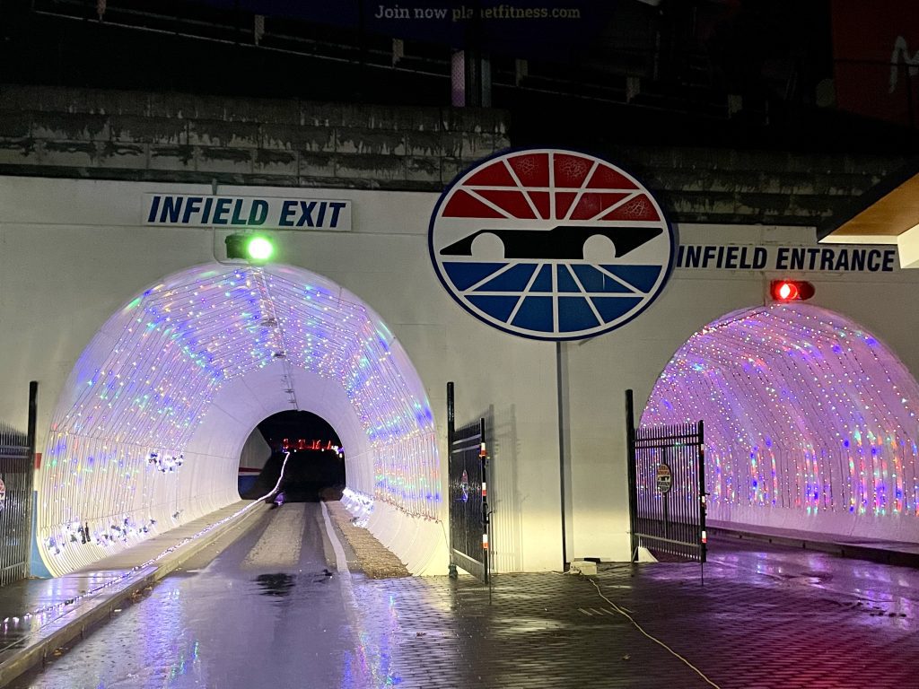 Two tunnels lined with Christmas lights along the New Hampshire Motor Speedway.